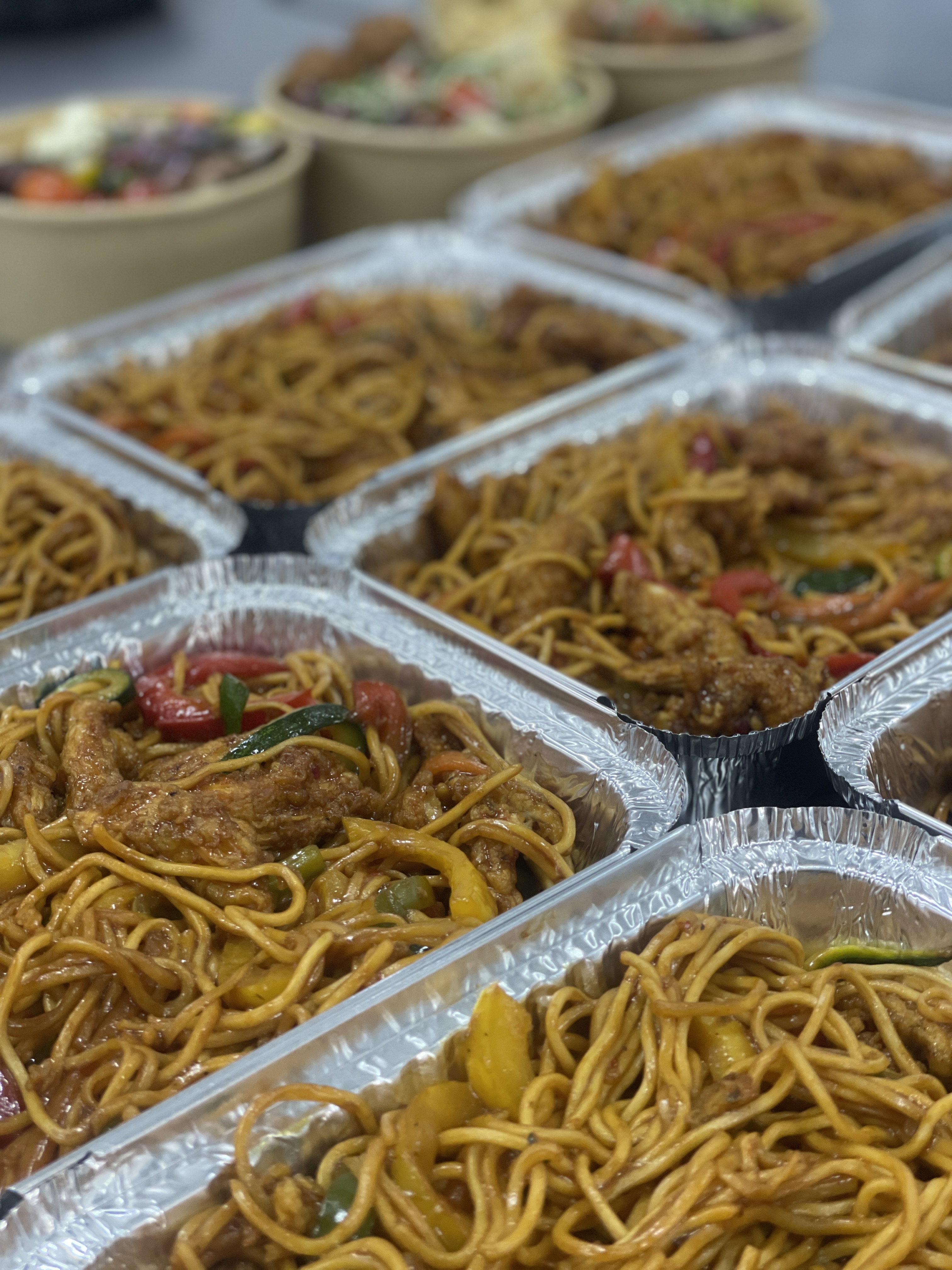 Outdoor spit braai barbecue with meat and vegetables grilling