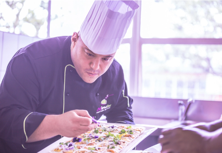 Professional chef plating food